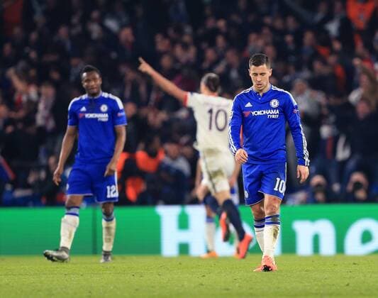 Chelsea s Eden Hazard looks on dejected as PGS s Zlatan Ibrahimovic celebrates scoring his sides second goal - UEFA Champions League - Chelsea vs Paris Saint Germain - Stamford Bridge - London - England - 9th March 2016 - Pic David Klein Sportimage EDITORIAL USE ONLY. No use with unauthorised audio, video, data, fixture lists, club league logos or live services. Online in-match use limited to 120 images, no video emulation. No use in betting, games or single club league player publications.