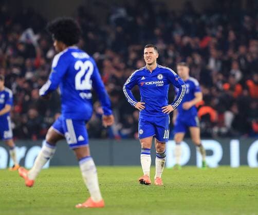 Chelsea s Eden Hazard looks on dejected as PGS s Zlatan Ibrahimovic celebrates scoring his sides second goal - UEFA Champions League - Chelsea vs Paris Saint Germain - Stamford Bridge - London - England - 9th March 2016 - Pic David Klein Sportimage EDITORIAL USE ONLY. No use with unauthorised audio, video, data, fixture lists, club league logos or live services. Online in-match use limited to 120 images, no video emulation. No use in betting, games or single club league player publications.