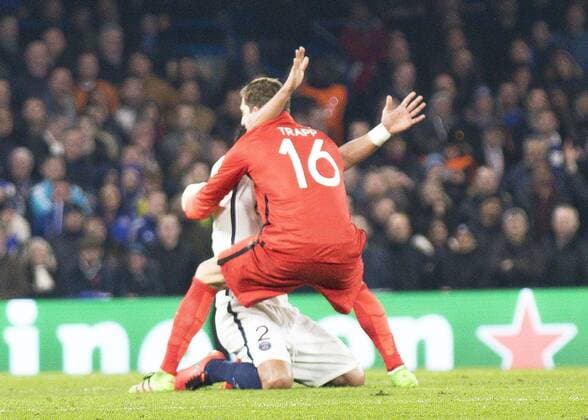 Football - 2015 2016 Champions League - Round of 16, Second Leg: Chelsea 1 vs. Paris Saint-Germain 2 Kevin Trapp of PSG rushes to celebrate with team mate Thiago Silva at Stamford Bridge. COLORSPORT DANIEL BEARHAM  che_psg