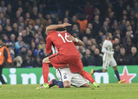 Football - 2015 2016 Champions League - Round of 16, Second Leg: Chelsea 1 vs. Paris Saint-Germain 2 Kevin Trapp of PSG rushes to celebrate with team mate Thiago Silva at Stamford Bridge. COLORSPORT DANIEL BEARHAM  che_psg