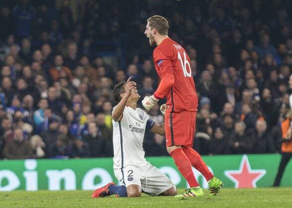 Football - 2015 2016 Champions League - Round of 16, Second Leg: Chelsea 1 vs. Paris Saint-Germain 2 Kevin Trapp of PSG and Thiago Silva celebrate at Stamford Bridge. COLORSPORT DANIEL BEARHAM  che_psg