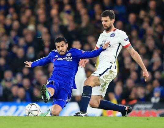 Chelsea s Pedro tussles with PSG s Thiago Motta - UEFA Champions League - Chelsea vs Paris Saint Germain - Stamford Bridge - London - England - 9th March 2016 - Pic David Klein Sportimage EDITORIAL USE ONLY. No use with unauthorised audio, video, data, fixture lists, club league logos or live services. Online in-match use limited to 120 images, no video emulation. No use in betting, games or single club league player publications.