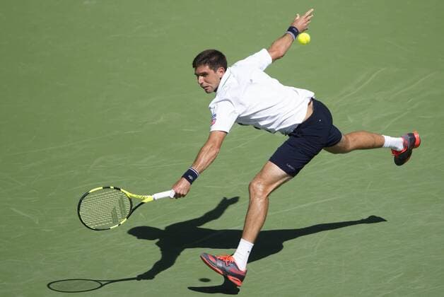 Federico Delbonis of Argentina hits a return during his third round men s singles against Andy Murray of Britain at the BNP Paribas Open in Indian Wells, the United States, on March 14, 2016. Federico Delbonis won 2-1. Yang Lei) (SP)U.S.-INDIAN WELLS-TENNIS-BNP PARIBAS OPEN YangxLeixC 
