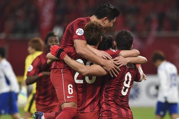 SHANGHAI, CHINA - MARCH 15: (CHINA OUT) Elkeson 9 of Shanghai SIPG celebrates with team mates after scoring his team s first goal during the AFC Champions League Group G match between Shanghai SIPG and Gamba Osaka at Shanghai Stadium on March 15, 2016 in Shanghai, China.  CFP481171920 