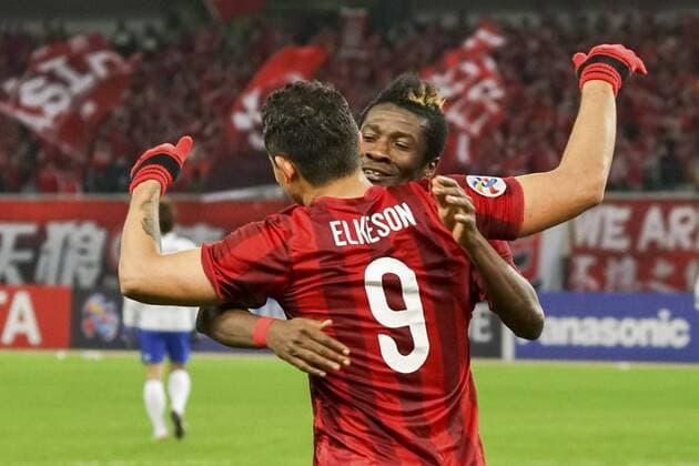 SHANGHAI, CHINA - MARCH 15: (CHINA OUT) Elkeson 9 of Shanghai SIPG celebrates with Asamoah Gyan after scoring his team s first goal during the AFC Champions League Group G match between Shanghai SIPG and Gamba Osaka at Shanghai Stadium on March 15, 2016 in Shanghai, China.  CFP481173314 