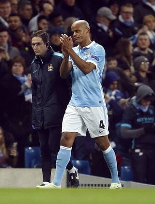 Vincent Kompany of Manchester City applauds the crowd as he goes off injured during the UEFA Champions League match at the Etihad Stadium. Photo credit should read: Philip Oldham Sportimage EDITORIAL USE ONLY. No use with unauthorised audio, video, data, fixture lists, club league logos or live services. Online in-match use limited to 120 images, no video emulation. No use in betting, games or single club league player publications.