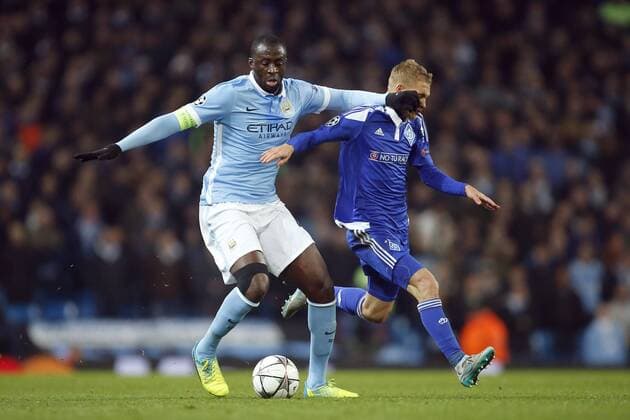 Yaya Toure of Manchester City battles Kiev?s Vitaliy Buyalskyi during the UEFA Champions League match at the Etihad Stadium. - PhilipxOldham Sportimage EDITORIAL USE ONLY. No use with unauthorised audio, video, data, fixture lists, club league logos or live services. Online in-match use limited to 120 images, no video emulation. No use in betting, games or single club league player publications.