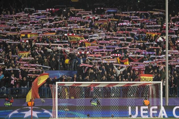 Atletico de Madrid s fans raise their flags at the end of the UEFA Champions League match. March 15,2016.  (20160315025)