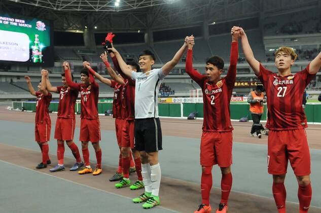 Players of China s Shanghai SIPG celebrate after defeating Japan s Gamba Osaka during their Group G third round match of the AFC Champions League 2016 in Shanghai, China, 15 March 2016. Brazilian forward Elkeson s double strike fired Shanghai SIPG to the top of their AFC Champions League group with a 2-1 win over Gamba Osaka on Tuesday (15 March 2016). Elkeson, off-loaded by reigning Asian champions Guangzhou Evergrande in January, looked an increasingly important signing as he sealed SIPG s second win in Group G. It was enough for Sven-Goran Eriksson s side to leapfrog Melbourne Victory, who were held 0-0 by South Korea¡¯s Suwon Samsung Bluewings in a combative contest earlier. Elkeson put SIPG ahead with a finish from close range on 41 minutes as the home side dominated. And after his Brazilian opposite number Patric nodded Gamba level on the hour-mark, Elkeson popped up again with the match-winning strike just two minutes later. The decisive goal may have made uncomfortable viewing for Evergrande fans as it came from a cross by Dario Conca, Elkeson s former team-mate at the Asian and Chinese title-holders. Meanwhile big-spending Chinese team Jiangsu Suning s unconvincing campaign remained stuck in second gear with a 0-0 draw away to FC Tokyo. Elkeson double fires Shanghai top of AFC Champions League group  20160315_33503