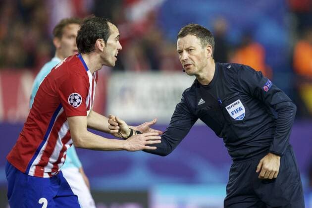 (L-R) Diego Godin of Club Atletico de Madrid, referee Mark Clattenburg during the UEFA Champions League Round of 16, Second leg match between Atletico madrid and PSV Eindhoven on March 15, 2016 at the Estadio Vicente Calder& 243;n in Madrid, Spain. Atletico Madrid v PSV Eindhoven UEFA Champions League 2015 2016 xVIxxIVx 5165428