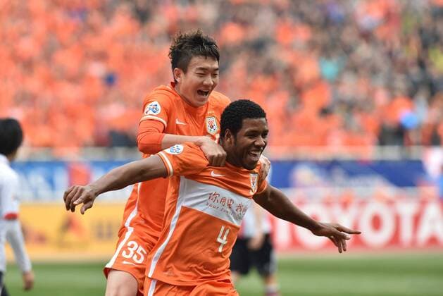 (160316) -- JINAN, March 16, 2016 -- Jucilei (R) of China s Shandong Luneng celebrates scoring during their Group F third round match against against FC Seoul of South Korea at the 2016 AFC Championships League in Jinan, capital of north China s Shandong Province, March 16, 2016. FC Seoul won 4-1. ) (SP)CHINA-JINAN-AFC CHAMPIONSHIPS LEAGUE 2016-GROUP F-SHANDONG LUNENG VS FC SEOUL XuxSuhui 