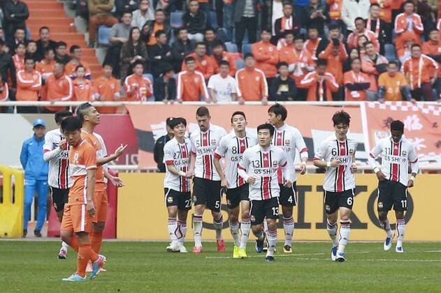 JINAN, CHINA - MARCH 16: (CHINA OUT) Carlos Adriano 11 of FC Seoul celebrates with team mates after scoring his team s first goal during the AFC Champions League Group F match between Shandong Luneng and FC Seoul at Jinan Olympic Sports Centre on March 16, 2016 in Jinan, China.  CFP481221378 