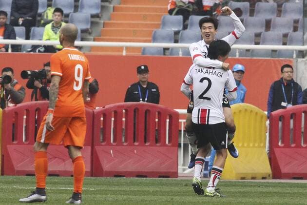 JINAN, CHINA - MARCH 16: (CHINA OUT) Go Yo-han 13 of FC Seoul celebrates with Yojiro Takahagi 2 after scoring his team second goal during the AFC Champions League Group F match between Shandong Luneng and FC Seoul at Jinan Olympic Sports Centre on March 16, 2016 in Jinan, China.  CFP481224986 
