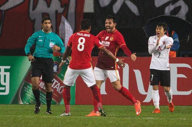 GUANGZHOU, CHINA - MARCH 16: (CHINA OUT) Ricardo Goulart 11 of Guangzhou Evergrande celebrates with Paulinho after scoring his team s second goal during the AFC Champions League Group H match between Guangzhou Evergrande and Urawa Red Diamonds at Tianhe Center on March 16, 2016 in Guangzhou, China.  CFP481231147 