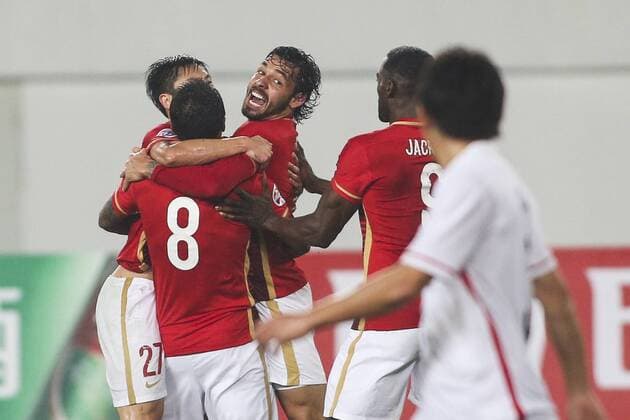 GUANGZHOU, CHINA - MARCH 16: (CHINA OUT) Ricardo Goulart 11 of Guangzhou Evergrande celebrates with team mates after scoring his team s second goal during the AFC Champions League Group H match between Guangzhou Evergrande and Urawa Red Diamonds at Tianhe Center on March 16, 2016 in Guangzhou, China.  CFP481231149 