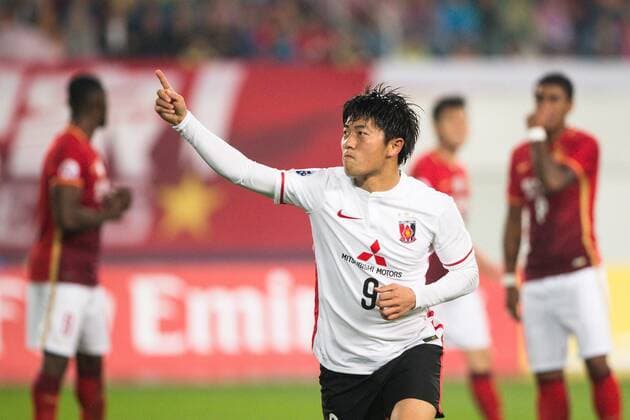 GUANGZHOU, CHINA - MARCH 16: (CHINA OUT) Yuki Muto 9 of Urawa Red Diamonds celebrates after scoring his team s first goal during the AFC Champions League Group H match between Guangzhou Evergrande and Urawa Red Diamonds at Tianhe Center on March 16, 2016 in Guangzhou, China.  CFP481232301 
