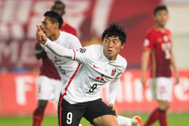 GUANGZHOU, CHINA - MARCH 16: (CHINA OUT) Yuki Muto 9 of Urawa Red Diamonds celebrates after scoring his team s first goal during the AFC Champions League Group H match between Guangzhou Evergrande and Urawa Red Diamonds at Tianhe Center on March 16, 2016 in Guangzhou, China.  CFP481232305 