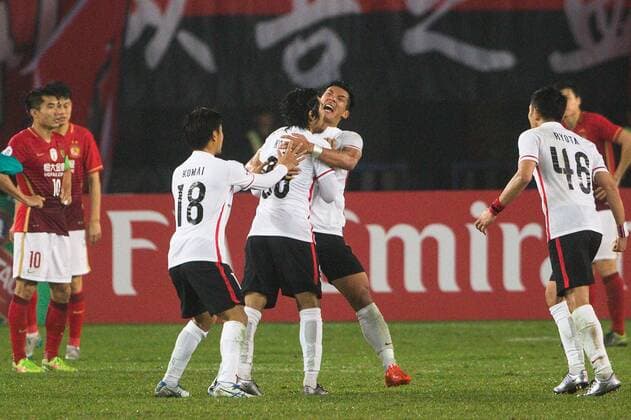 GUANGZHOU, CHINA - MARCH 16: (CHINA OUT) Shinzoh Kohrogi 30 of Urawa Red Diamonds celebrates with team mates after scoring his team s second goal during the AFC Champions League Group H match between Guangzhou Evergrande and Urawa Red Diamonds at Tianhe Center on March 16, 2016 in Guangzhou, China.  CFP481236761 