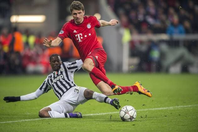 (R-L) Thomas Muller (Bayern), Patrice Evra (Juventus), MARCH 16, 2016 - Football Soccer : UEFA Champions League Round of 16, 2nd leg match between FC Bayern Munchen 4-2 Juventus at Allianz Arena in Munich, Germany. NoxThirdxPartyxSales  (ptmb089640)