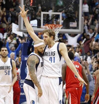 March 20, 2016 - Dallas, TX, USA - Dallas Mavericks forward Dirk Nowitzki (41) celebrates his three-pointer with guard Deron Williams, left, during overtime on Sunday, March 20, 2016, at the American Airlines Center in Dallas. Portland Trail Blazers at Dallas Mavericks - ZUMAm67_
