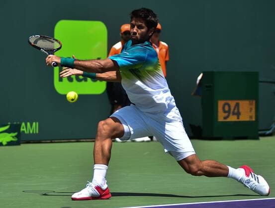 Spanish tennis player Fernando Verdasco returns the ball to Luxebourg Gilles Mulller during a Miami Tennis Open match held in Cayo Vizcaino, Miami, FL, United States, 23 March 2016. FERNANDO VERDASCO VS. GILLES MULLER !ACHTUNG: NUR REDAKTIONELLE NUTZUNG!  MIA005 20160323-635943696207543813
