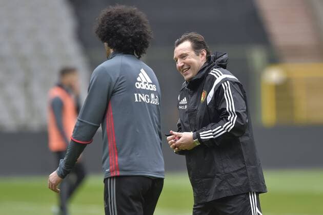 Belgium s Marouane Fellaini and Belgium s head coach Marc Wilmots pictured during a training session of the Belgian national soccer team Red Devils, Thursday 24 March 2016 in Brussels. The Red Devils will play a friendly game in and against Portugal on 29 March, the match was moved due to safety concerns after the Brussels terrorists attacks. The game is a preparation for the upcoming Euro2016. PETERxDExVOECHT  x04819954x