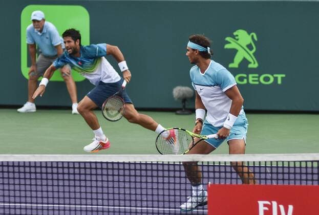Spanish tennis players Rafael Nadal (R) and Fernando Verdasco (L) return the ball to Italy Simone Bolelli and Andreas Seppi during the first journey of the Masculine Miami Tennis Open in Cayo Vizcaino, Miami, FL, United States, 24 March 2016. RAFAEL NADAL AND FERNANDO VERDASCO VS SIMONE BOLELLI AND ANDREAS SEPPI !ACHTUNG: NUR REDAKTIONELLE NUTZUNG!  MIA031 20160325-635944671262638664