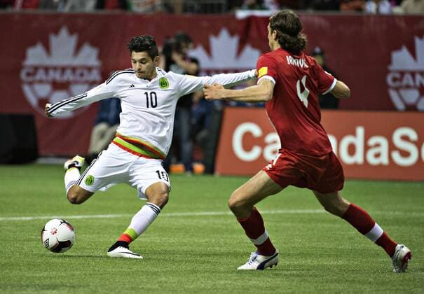 (160326) -- VANCOUVER, March 26, 2016 -- Mexico s Jesus Manuel Corona (L) vies with Canada s Dejan Jakovic during a qualifier game of 2018 FIFA World Cup WM Weltmeisterschaft Fussball in Vancouver, Canada, March 25, 2016. Mexico won 3-0. ) (SP)CANADA-VANCOUVER-FIFA 2018 WORLD CUP-QUALIFICATION MATCH-CANADA VS MEXICO AndrewxSoong 