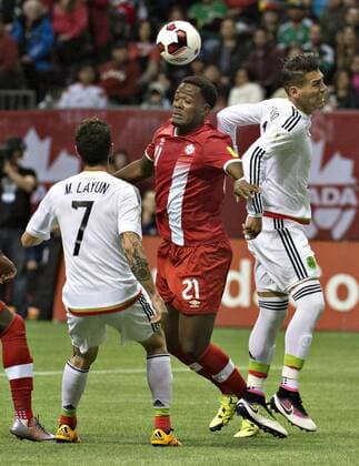 (160326) -- VANCOUVER, March 26, 2016 -- Canada s Cyle Larin (C) vies with Mexico s Miguel Layun (L) and Diego Reyes during a qualifier game of 2018 FIFA World Cup WM Weltmeisterschaft Fussball in Vancouver, Canada, March 25, 2016. Mexico won 3-0. ) (SP)CANADA-VANCOUVER-FIFA 2018 WORLD CUP-QUALIFICATION MATCH-CANADA VS MEXICO AndrewxSoong 