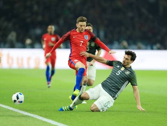 Germany s Mats Hummels tussles with England s Adam Lallana during the International Friendly Länderspiel match at Olympiastadion. Photo credit should read: David Klein Sportimage EDITORIAL USE ONLY. No use with unauthorised audio, video, data, fixture lists, club league logos or live services. Online in-match use limited to 120 images, no video emulation. No use in betting, games or single club league player publications.
