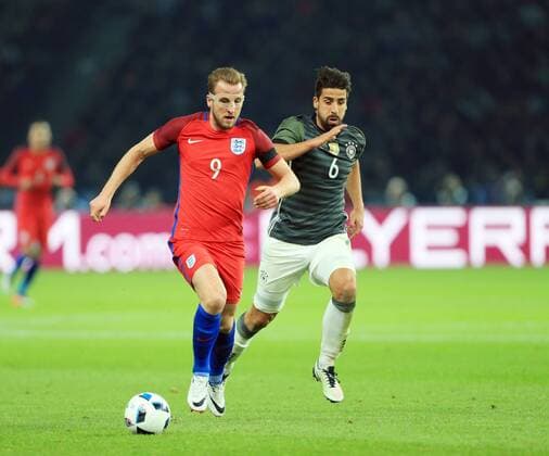 Germany s Sami Khedira tussles with England s Harry Kane during the International Friendly Länderspiel match at Olympiastadion. Photo credit should read: David Klein Sportimage EDITORIAL USE ONLY. No use with unauthorised audio, video, data, fixture lists, club league logos or live services. Online in-match use limited to 120 images, no video emulation. No use in betting, games or single club league player publications.