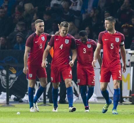 26.03.2016. Olympiastadion Berlin, Berlin, Germany. International Football Friendly Germany versus England. England& x2019;s Eric Dier (centre 4) gets a pat on the back from Henderson and Rose after scoring the winning goal in the last minute to make the final score 2-3 xCraigxMercerx  ActionPlus11722453