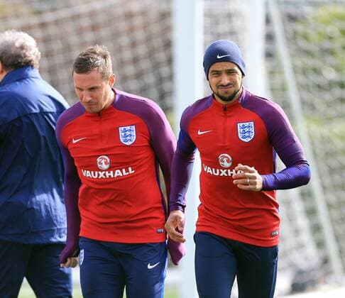 England s Theo Walcott and Phil Jagielka in action during training at the Tottenham Hotspur Training Centre. Photo credit should read: David Klein Sportimage EDITORIAL USE ONLY. No use with unauthorised audio, video, data, fixture lists, club league logos or live services. Online in-match use limited to 120 images, no video emulation. No use in betting, games or single club league player publications.
