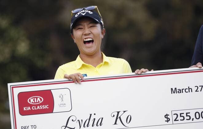 March 27, 2016 - Carlsbad, USA - CARLSBAD, March 27, 2016 Lydia Ko laughs while holding a check for 255,000 dollars after winning the Kia Classic at the Aviara Golf Club in Carlsbad on Sunday. -Mandatory Photo Credit: Photo by Hayne Palmour IV San Diego Union-Tribune, LLC Lydia Ko laughs while holding a check for 255,000 dollars after winning the Kia Classic. - ZUMAs44_