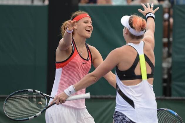 March 28, 2016 - Miami, Florida, United States - LUCIE SAFAROVA (left) and BETHANIE MATTEK-SANDS celebrate winning their doubles match vs. Vesnina Kasatkina at the Miami Open Tennis 2016 - Miami Open - Day 8 - ZUMAl132