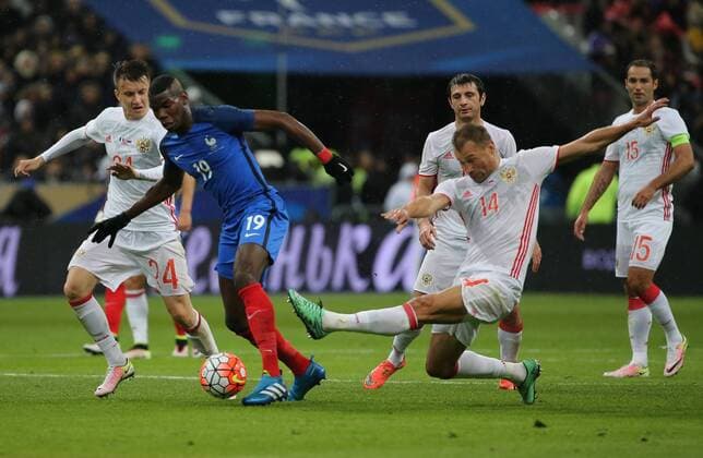 SAINT-DENIS, FRANCE. MARCH 29, 2016. Russia s Alexander Golovin, France s Paul Pogba, Russia s Alan Dzagoev, Vasili Berezutski and Roman Shirokov (L-R) fight for the ball in their friendly football match at the Stade de France. Alexander Demianchuk TASS  TS01DDF9