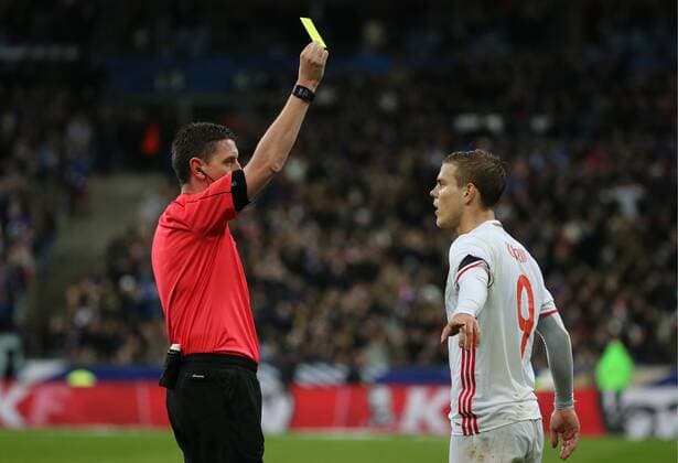 SAINT-DENIS, FRANCE. MARCH 29, 2016. Russia s Alexander Kokorin (R) receives a yellow card in a friendly football match against France at the Stade de France. Alexander Demianchuk TASS  TS01DDFA