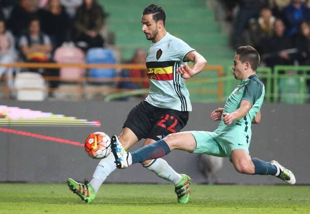 Belgium s Nacer Chadli and Portugal s Andre Gomes fight for the ball during a soccer game between the Portugal national team Nationalteam and the Belgian Red Devils in Leiria, Portugal, Tuesday 29 March 2016, a preparation for the upcoming Euro2016 tournament. The match was moved due to safety concerns after the Brussels terrorists attacks. VIRGINIExLEFOUR  x04823073x