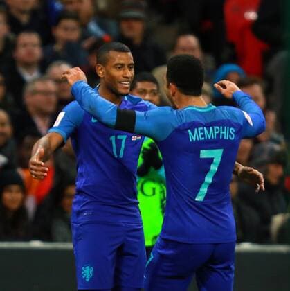 England v Netherlands . . Wembley, London, UK . . 29.03.2016 Luciano Narsingh (N) celebrates scoring the winning goal for Netherlands with Memphis Depay (N). 1-2 