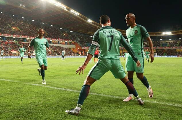 Portugal s Nani, Portugal s Cristiano Ronaldo and Portugal s Joao Mario celebrate after Cristiano scored during a soccer game between the Portugal national team Nationalteam and the Belgian Red Devils in Leiria, Portugal, Tuesday 29 March 2016, a preparation for the upcoming Euro2016 tournament. The match was moved due to safety concerns after the Brussels terrorists attacks. VIRGINIExLEFOUR  x04823591x