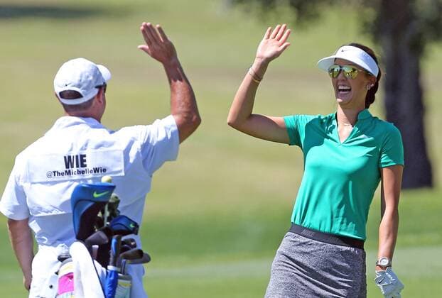 April 01, 2016: Michelle Wie celebrates with her caddie after she holes out for eagle on the 12th hole during the second round of the 2016 ANA Inspiration at the Mission Hills Country Club in Rancho Mirage, California. LPGA Golf Damen 2016: ANA Inspiration Championship APR 01 - ZUMAcb8_