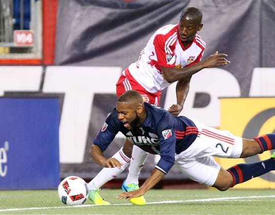 April 1, 2016; Foxborough, MA, USA; New England Revolution defender Andrew Farrell (2) and New York Red Bulls forward Bradley Wright-Phillips (99) battle for the ball during the first half of an MLS Fussball Herren USA game between the New England Revolution and New York Red Bulls at Gillette Stadium. New England won 1-0. MLS 2016: Red Bulls vs Revolution APR 01 - ZUMAc04_