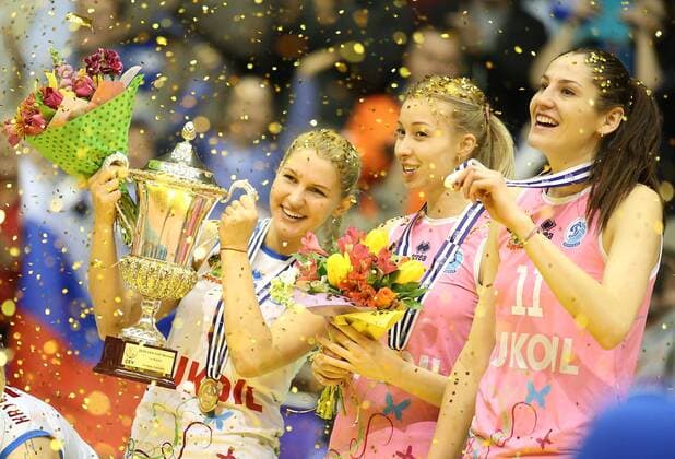 KRASNODAR, RUSSIA. APRIL 2, 2016. Dinamo s Mariia Bibina, Liubov Sokolova and Tatiana Kosheleva (L-R) celebrate their victory in the rematch of the 2015 16 Season CEV Women s Volleyball Cup Finals against Galatasaray Istanbul at Olimp Sports Palace. Dinamo Krasnodar won the game 3:0. Vitaly Timkiv TASS  TS01E4FA