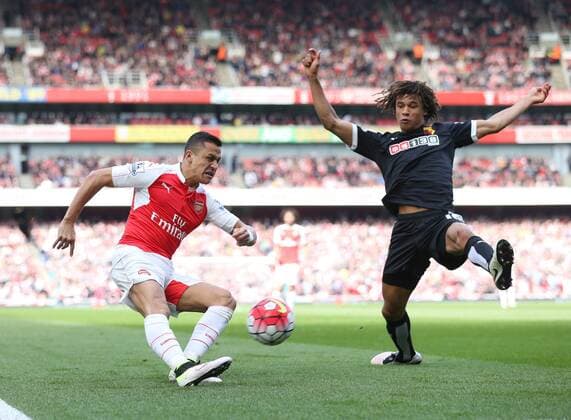 Arsenal s Alexis Sanchez tussles with Watford s Nathan Ake during the Premier League match at Emirates Stadium. Photo credit should read: David Klein Sportimage EDITORIAL USE ONLY. No use with unauthorised audio, video, data, fixture lists, club league logos or live services. Online in-match use limited to 120 images, no video emulation. No use in betting, games or single club league player publications.