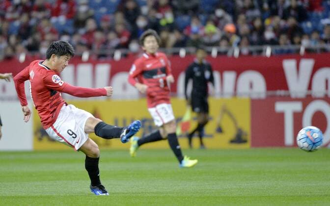 Urawa Red Diamonds vs Guangzhou Evergrande in ACL Striker Yuki Muto of Japan s Urawa Red Diamonds shoots during the first half of an Asian Champions League Group H match against China s Guangzhou Evergrande in Saitama, north of Tokyo, on April 5, 2016. 