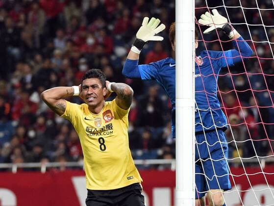 (160405) -- SAITAMA, April 5, 2016 -- Paulinho (L) of China s Guangzhou Evergrandtaobao reacts during the AFC Champions League Group H football match against Japan s Urawa Red Diamonds in Saitama, Japan, April 5, 2016. ) (SP)JAPAN-SAITAMA-FOOTBALL-AFC CHAMPIONS LEAGUE LiuxDawei 