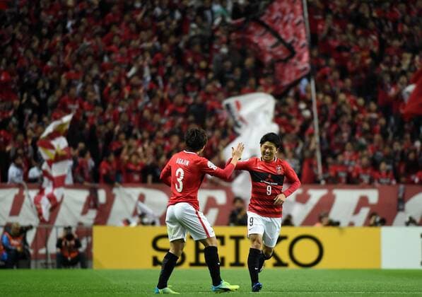 (160405) -- SAITAMA, April 5, 2016 -- Yuki Muto (R) of Japan s Urawa Red Diamonds celebrates his goal during the AFC Champions League Group H football match against China s Guangzhou Evergrandtaobao in Saitama, Japan, April 5, 2016. ) (SP)JAPAN-SAITAMA-FOOTBALL-AFC CHAMPIONS LEAGUE LiuxDawei 