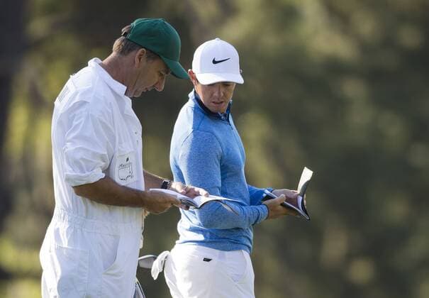 Rory McIlroy talks to his caddie J.P. Fitzgerald on the 2nd fairway during a practice round before the 2016 Masters Tournament at Augusta National in Augusta, Georgia on April 5, 2016.  AUG20160405306 KEVINxDIETSCH
