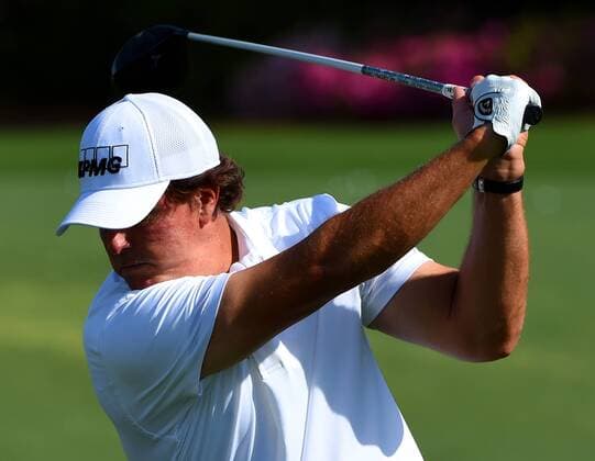 April 6, 2016 - Augusta, GA, USA - Phil Mickelson concentrates on his follow through as he practices on Wednesday, April 6, 2016, at Augusta National Golf Club in Augusta, Ga. First round action of The Masters tournament begins on Thursday. Masters practice - ZUMAm67_