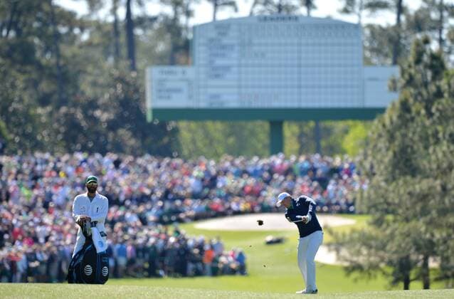 Caddie Michael Greller watches Jordan Spieth hit his approach shot to the 3rd hole in the first round of the 2016 Masters Tournament at Augusta National in Augusta, Georgia on April 7, 2016.  MAS20160407128 KEVINxDIETSCH